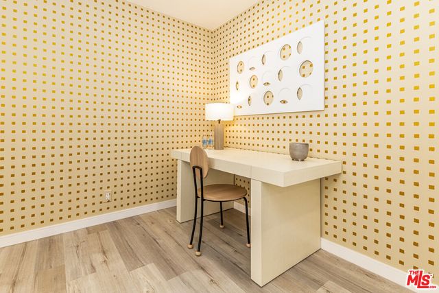 a table that has a sink and a chair in it