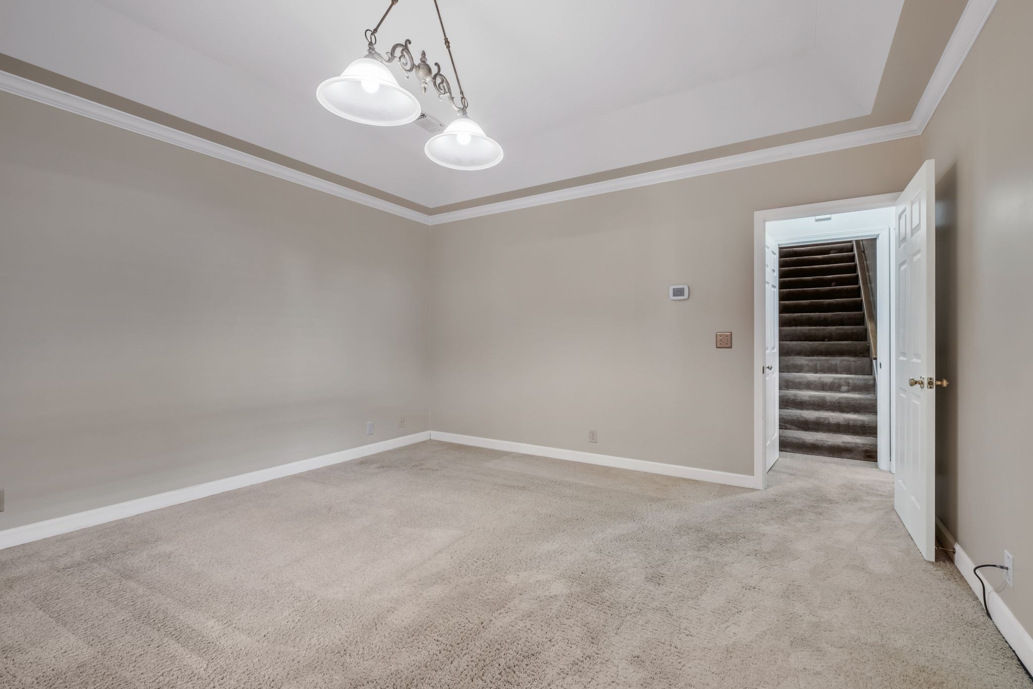 725 General George Patton Road Nashville, TN 37221 - Photo 17 of 32 an empty room with chandelier fan and windows