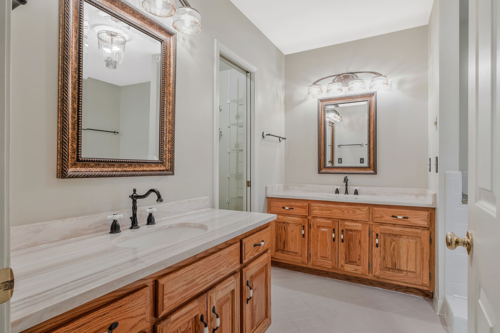 725 General George Patton Road Nashville, TN 37221 - Photo 18 of 32 a bathroom with a double vanity sink and mirror