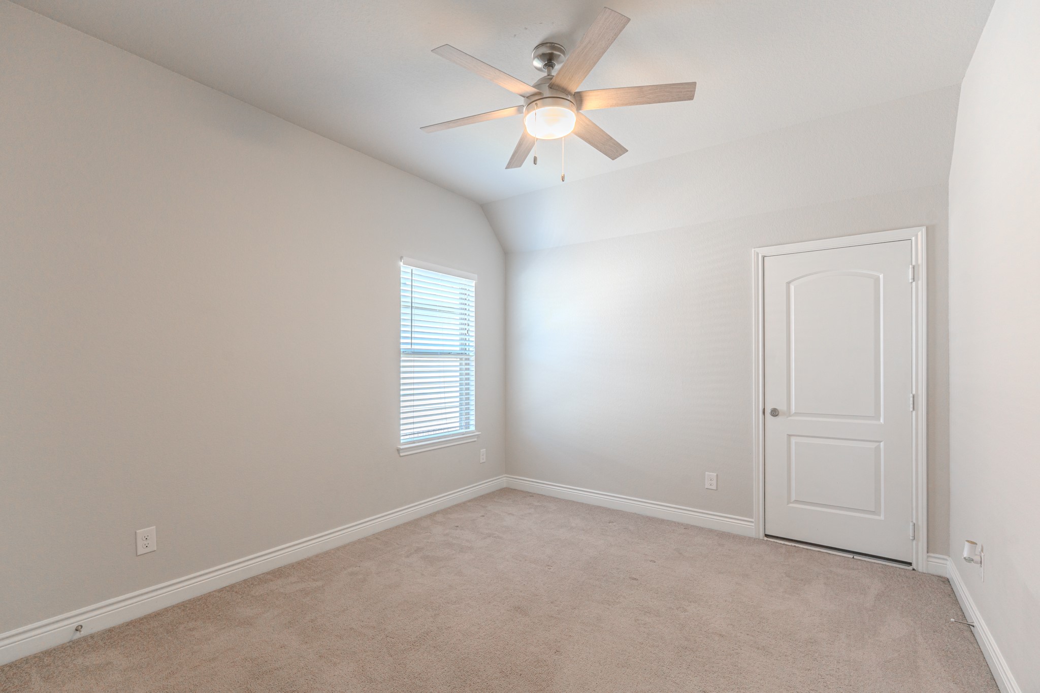 27918 Madison Bend Drive Spring, TX 77386 - Photo 39 of 50 an empty room with windows and ceiling fan