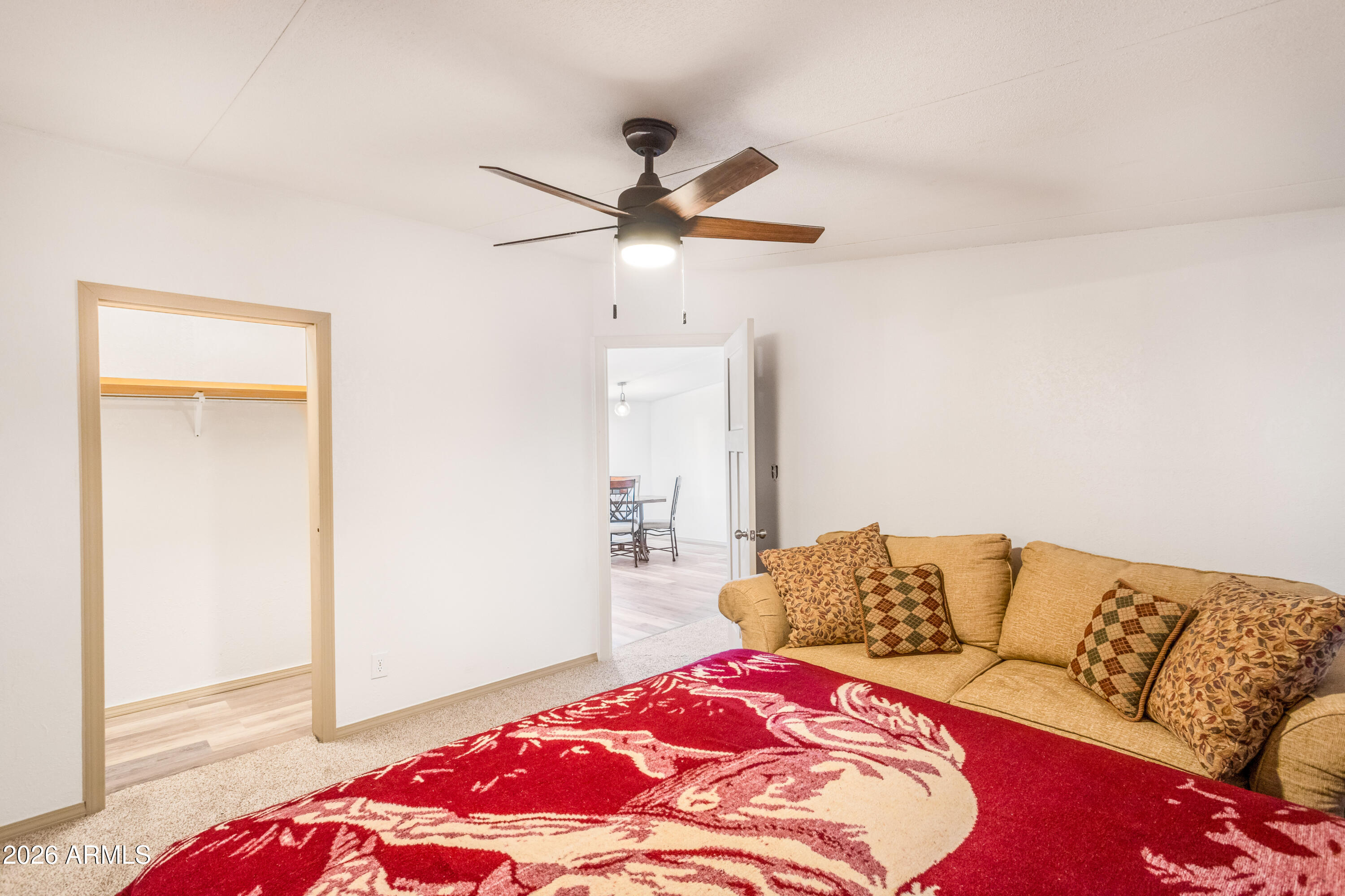 10405 North Mormon Road Elfrida, AZ 85610 - Photo 18 of 43 a bedroom with a bed and ceiling fan