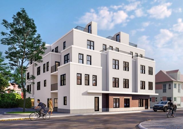 a front view of a building with lot of cars parked on road