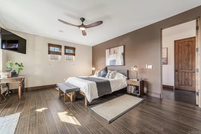 a spacious bedroom with a bed and a table