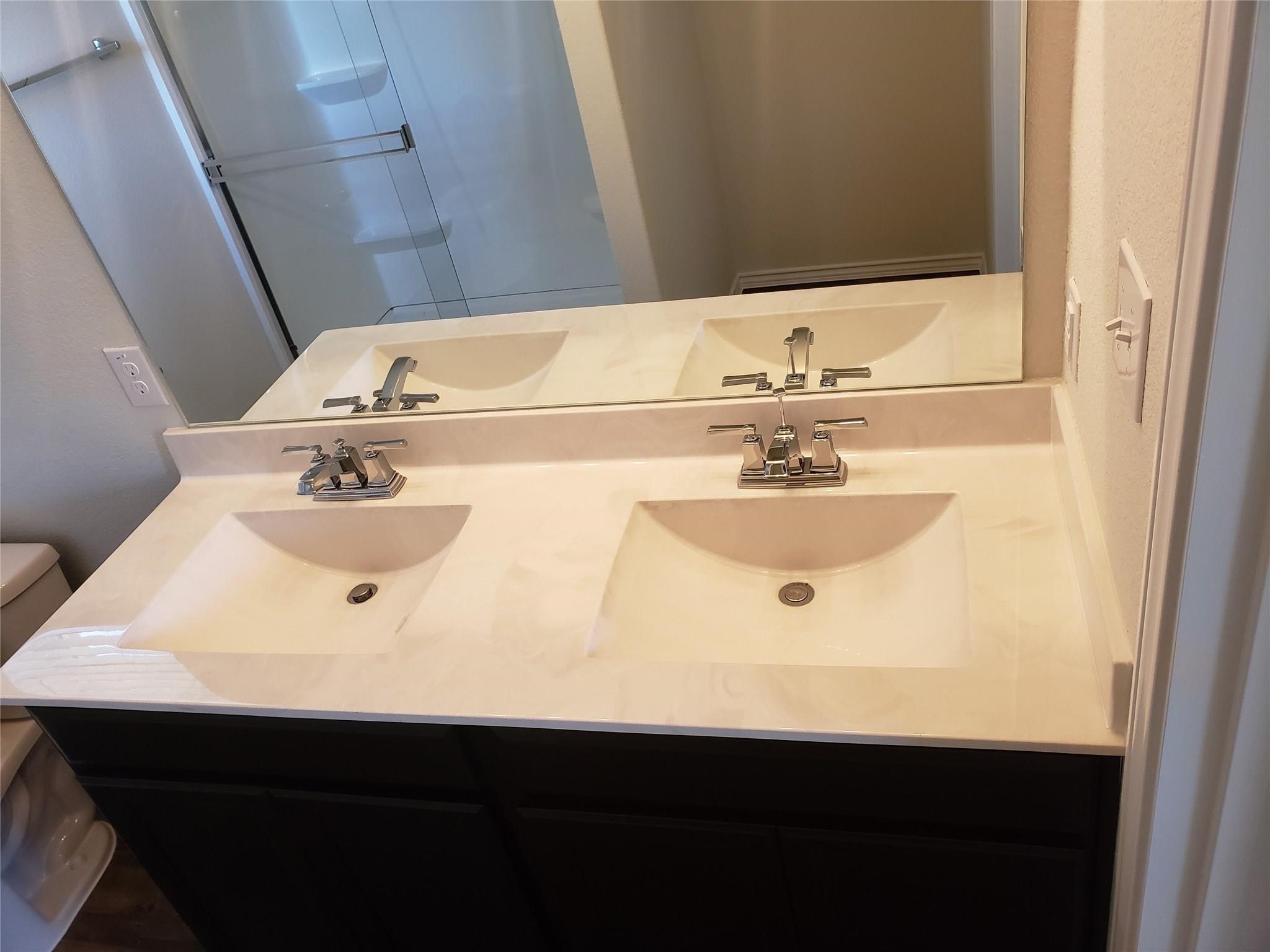 24006 Swather Way Hockley, TX 77447 - Photo 12 of 20 a bathroom with a sink and a mirror