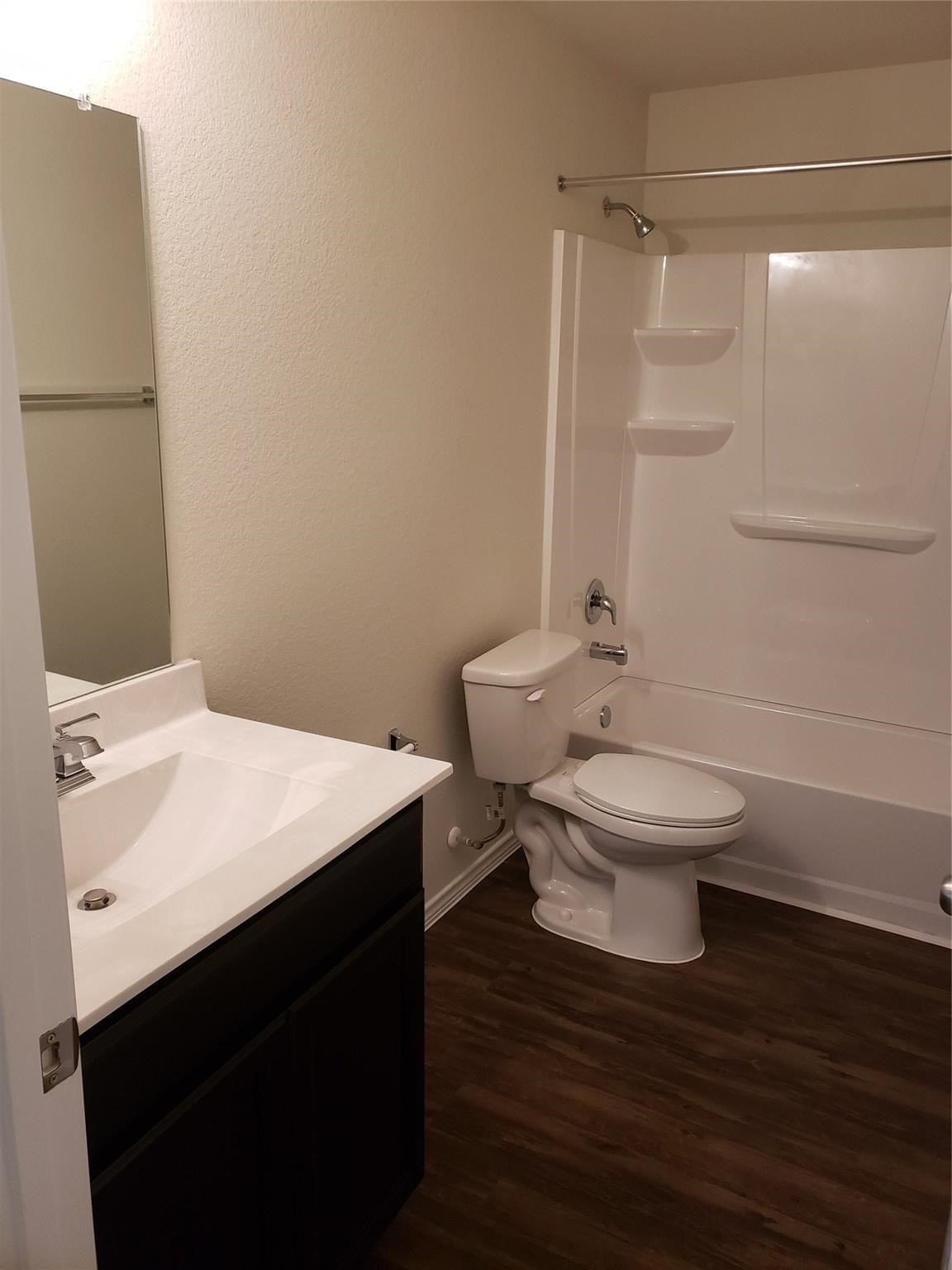 24006 Swather Way Hockley, TX 77447 - Photo 15 of 20 a white toilet sitting next to a bathroom sink