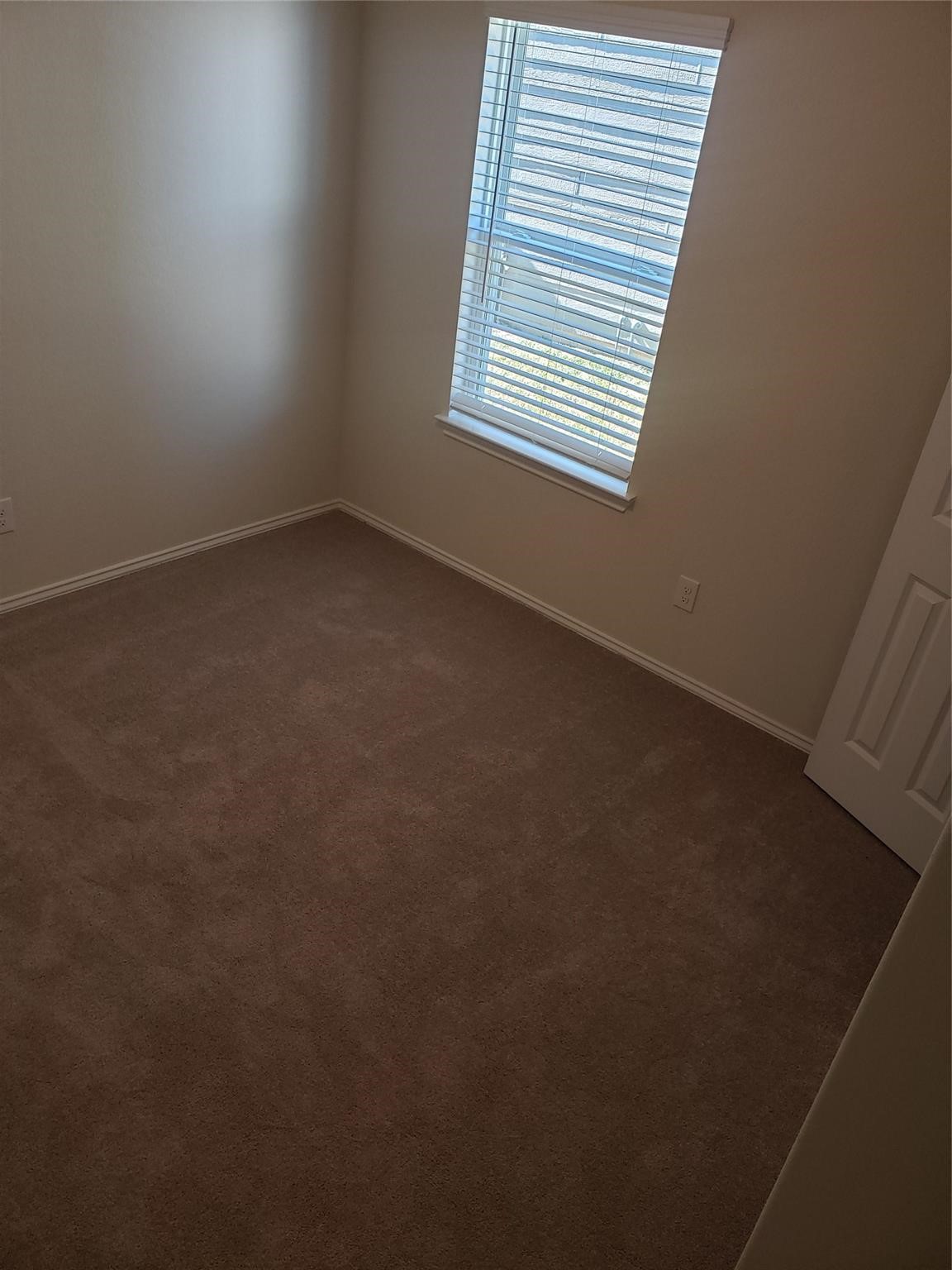 24006 Swather Way Hockley, TX 77447 - Photo 17 of 20 an empty room with a window
