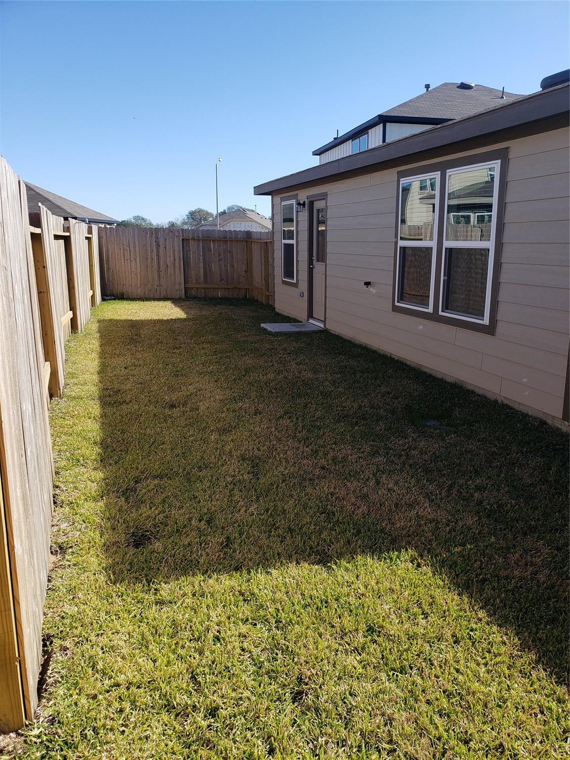 24006 Swather Way Hockley, TX 77447 - Photo 19 of 20 a view of a house with a small yard and wooden floor