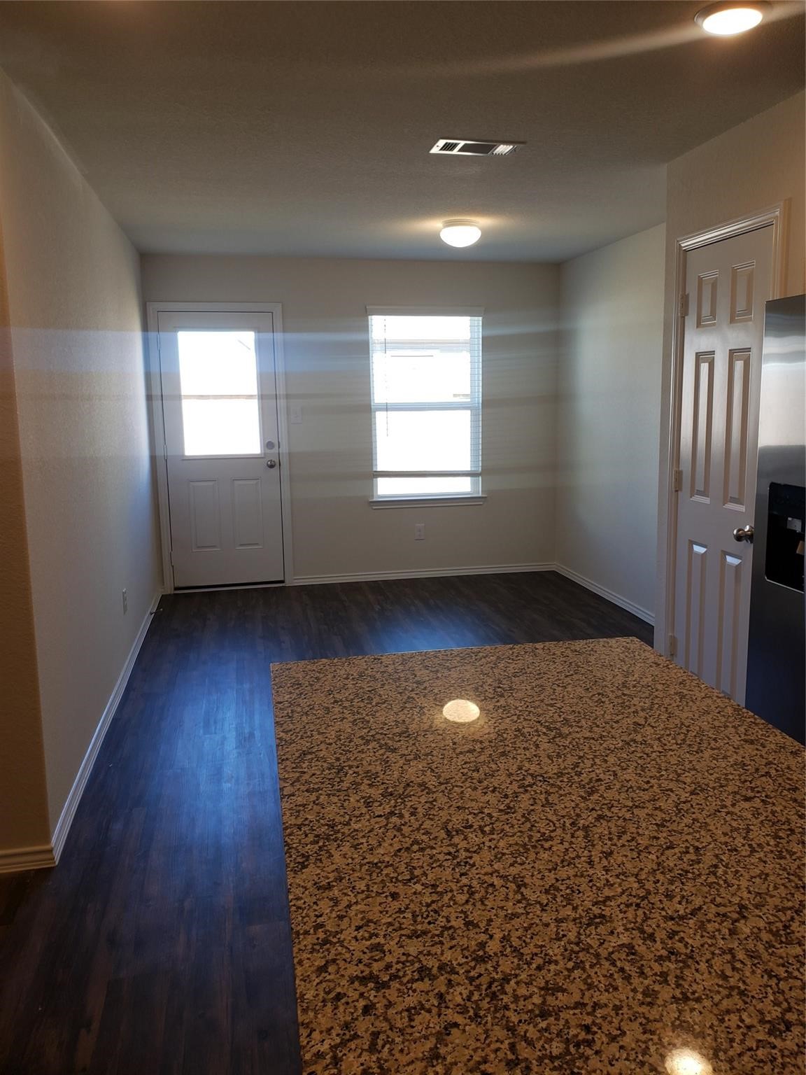 24006 Swather Way Hockley, TX 77447 - Photo 5 of 20 wooden floor in an empty room with a window