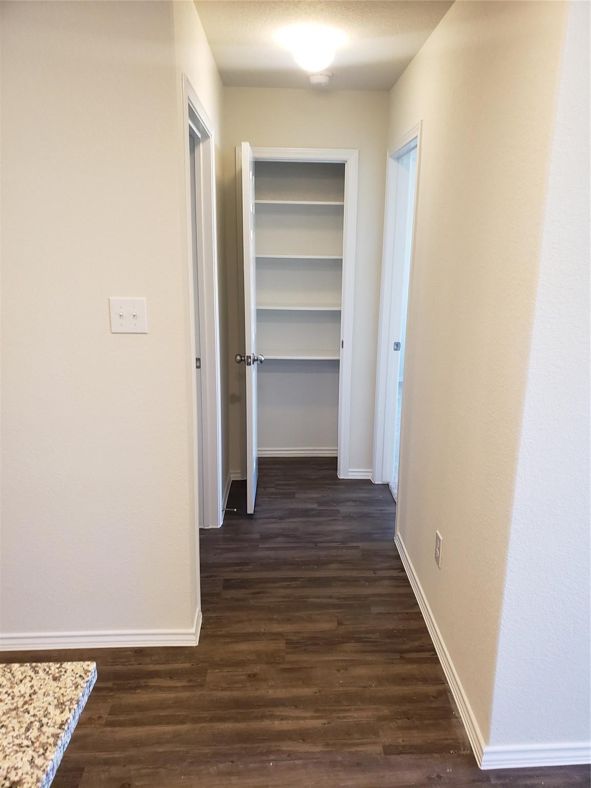 24006 Swather Way Hockley, TX 77447 - Photo 9 of 20 a view of a hallway with wooden floor