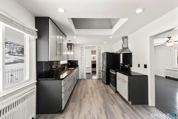 a large kitchen with stainless steel appliances
