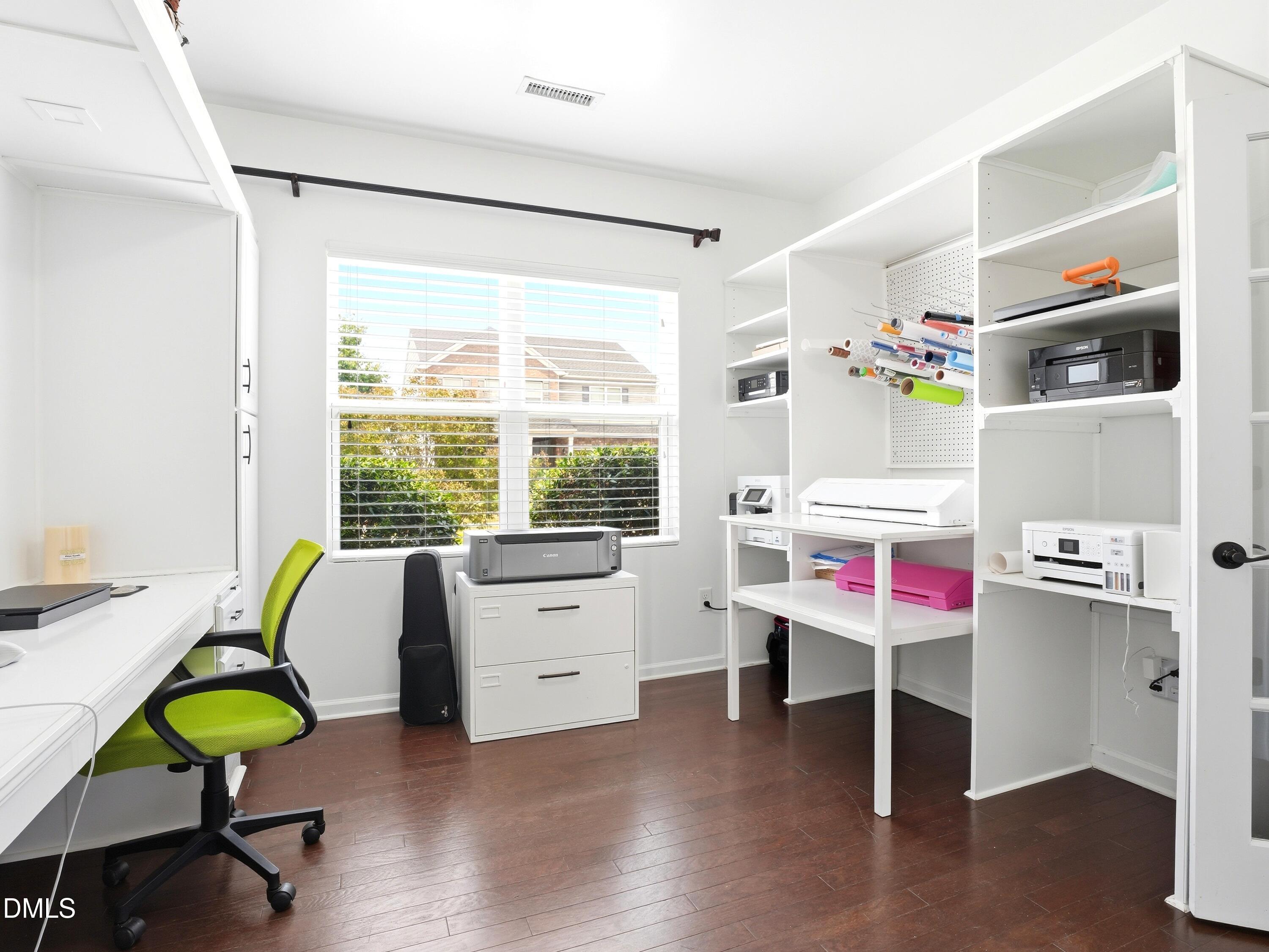 8128 Hovingham Way Raleigh, NC 27616 - Photo 37 of 40 a bedroom with a bed and a desk