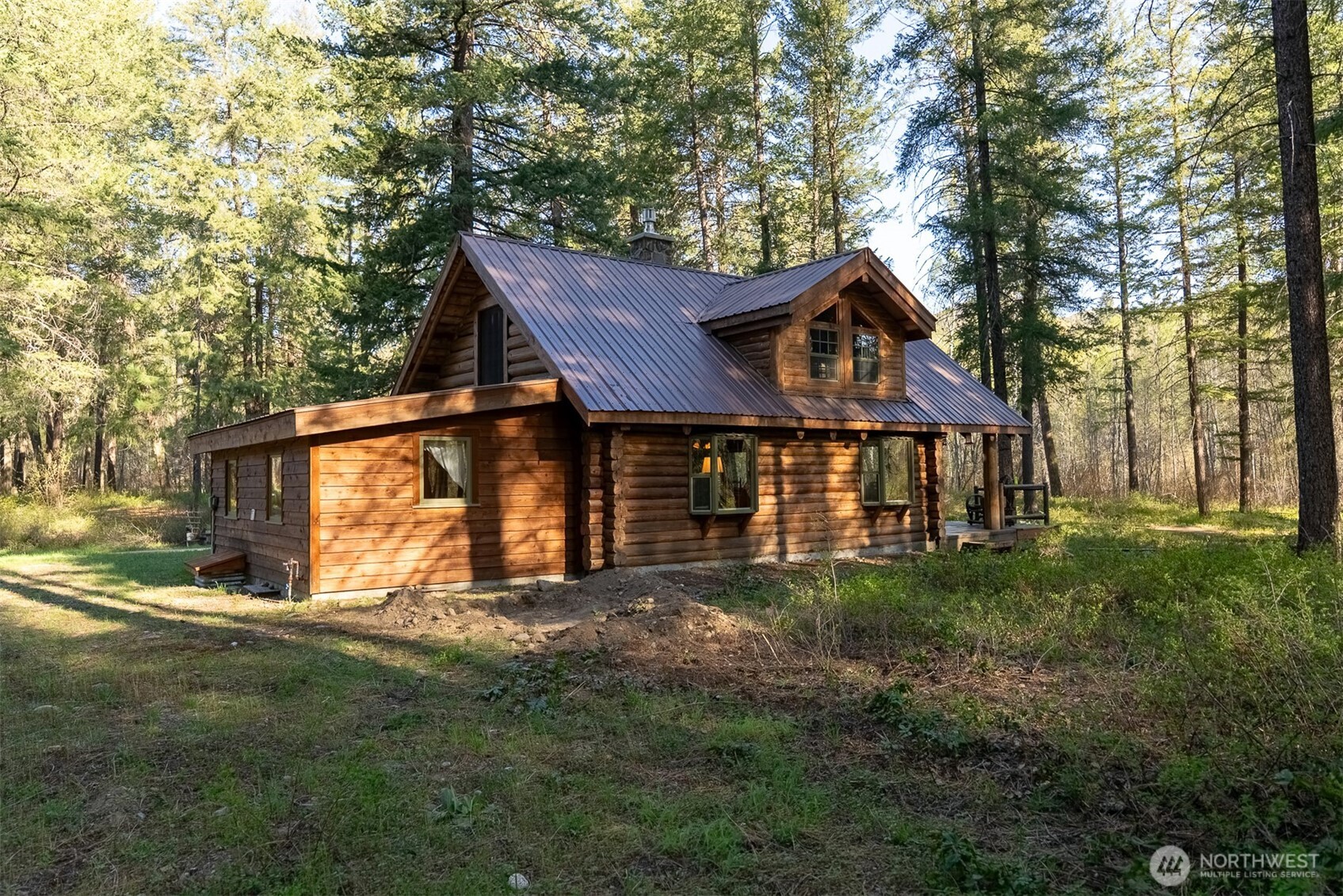 583 B Twisp River Road Twisp, WA 98856 - Photo 27 of 39 a front view of a house with a yard