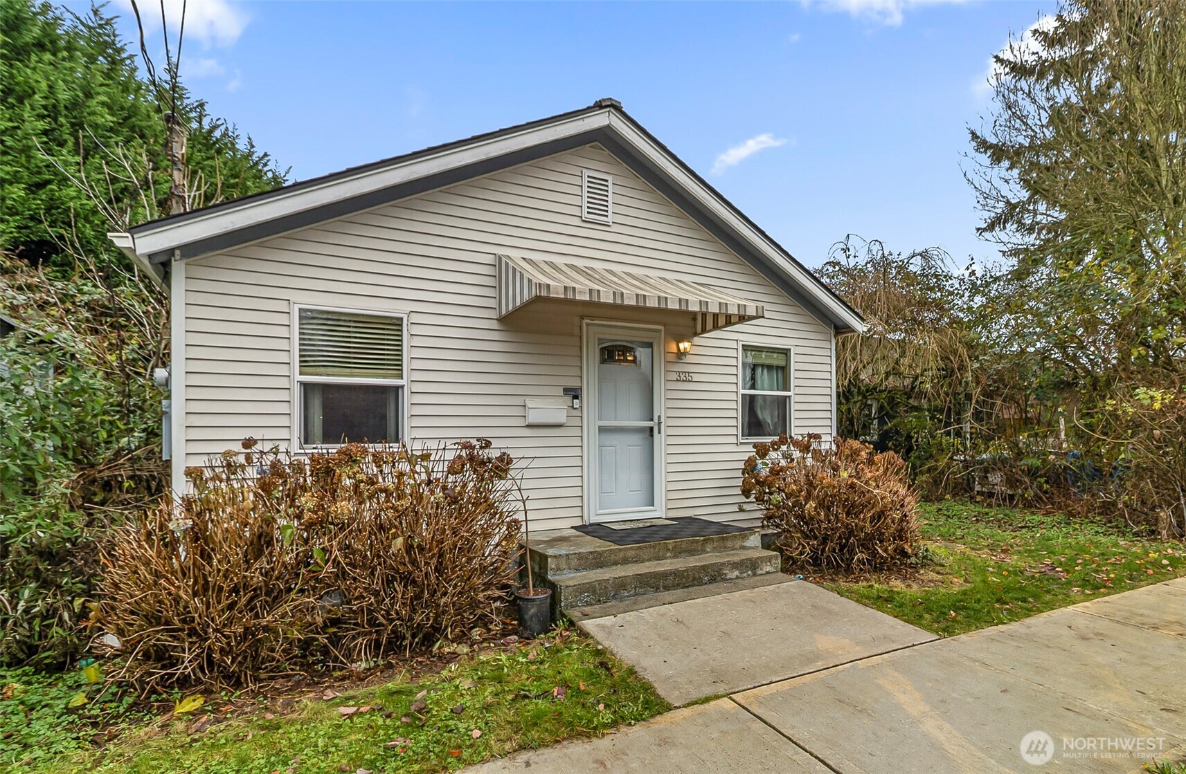 335 North Madison Street Monroe, WA 98272 - Photo 1 of 38 a view of a house with backyard