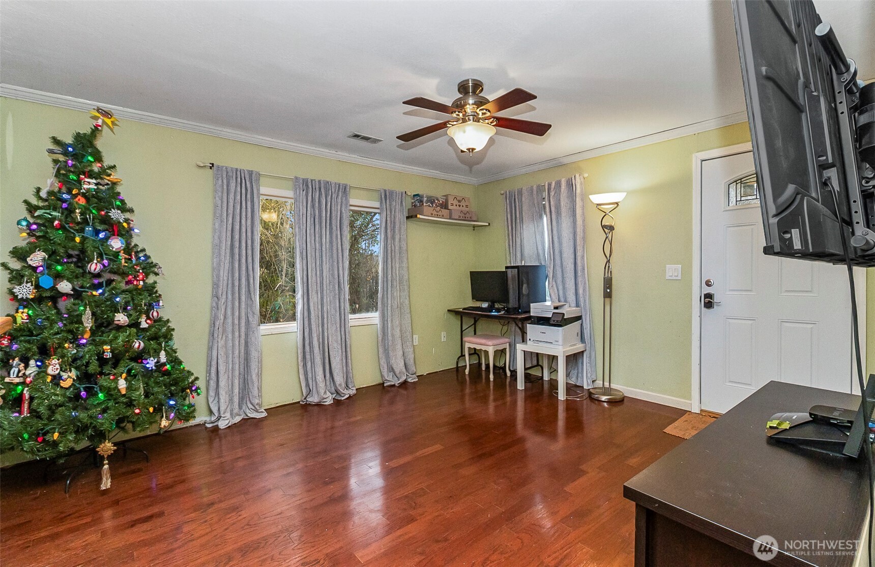 335 North Madison Street Monroe, WA 98272 - Photo 17 of 38 a view of a livingroom with furniture window wooden floor and a window