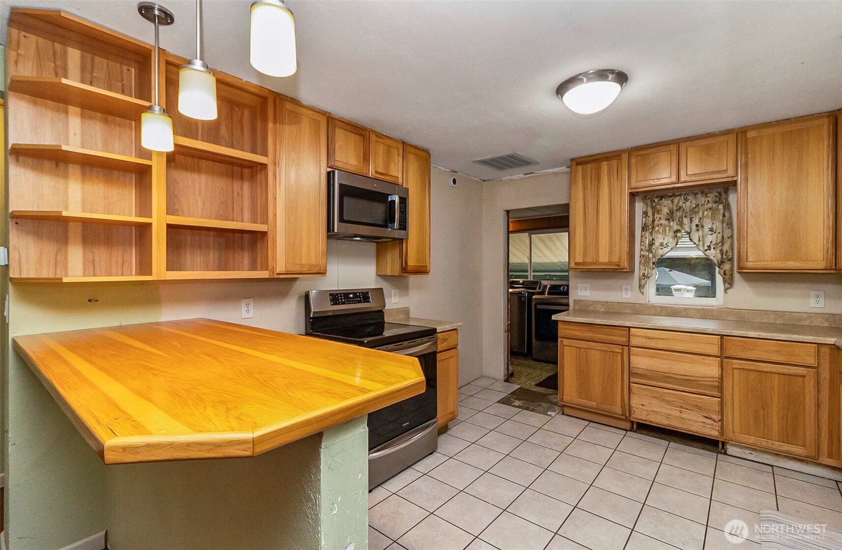 335 North Madison Street Monroe, WA 98272 - Photo 20 of 38 a room with storage and utility