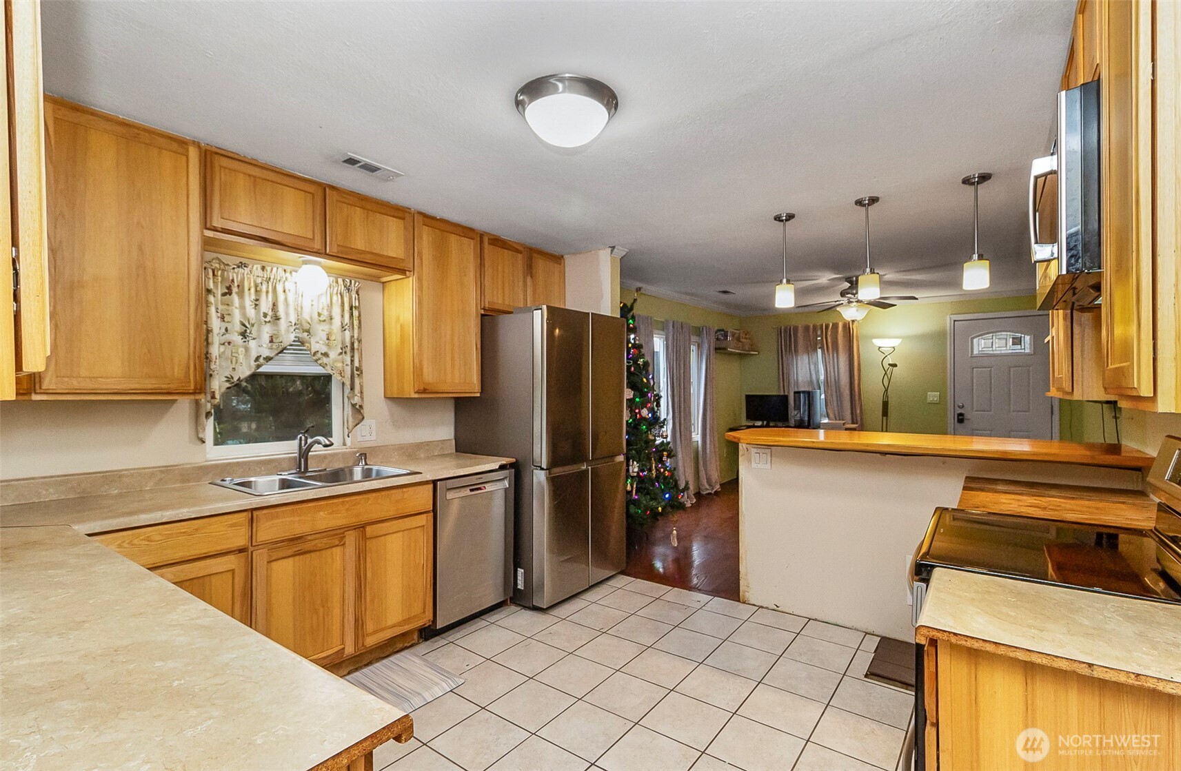 335 North Madison Street Monroe, WA 98272 - Photo 22 of 38 a kitchen with a sink appliances and cabinets