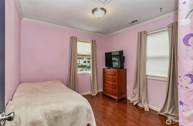 a bed room with a bed and a mirror