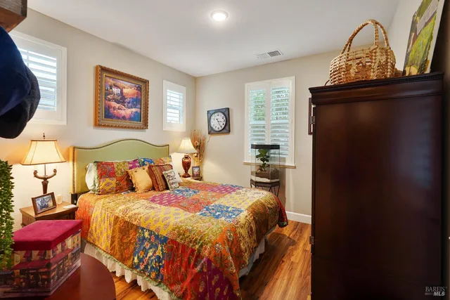 a bedroom with a bed and a mirror