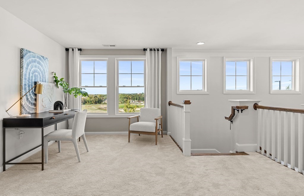 2 Cooley Drive, Unit 15 Woburn, MA 01801 - Photo 23 of 34 a living room with furniture and a window