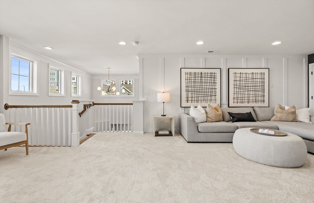 2 Cooley Drive, Unit 15 Woburn, MA 01801 - Photo 24 of 34 a living room with furniture and a large window