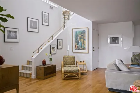 a view of a chairs and table in a balcony
