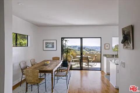 a kitchen with a sink stove and refrigerator