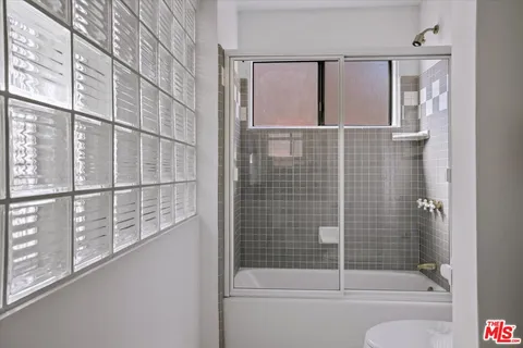 a bedroom with a bed and a table in it