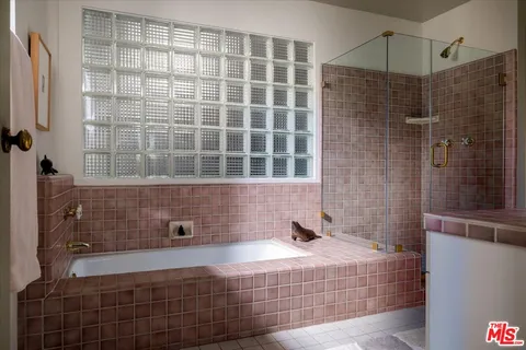 a view of a chairs and table in a balcony