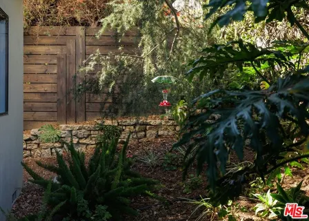 an aerial view of houses with a street