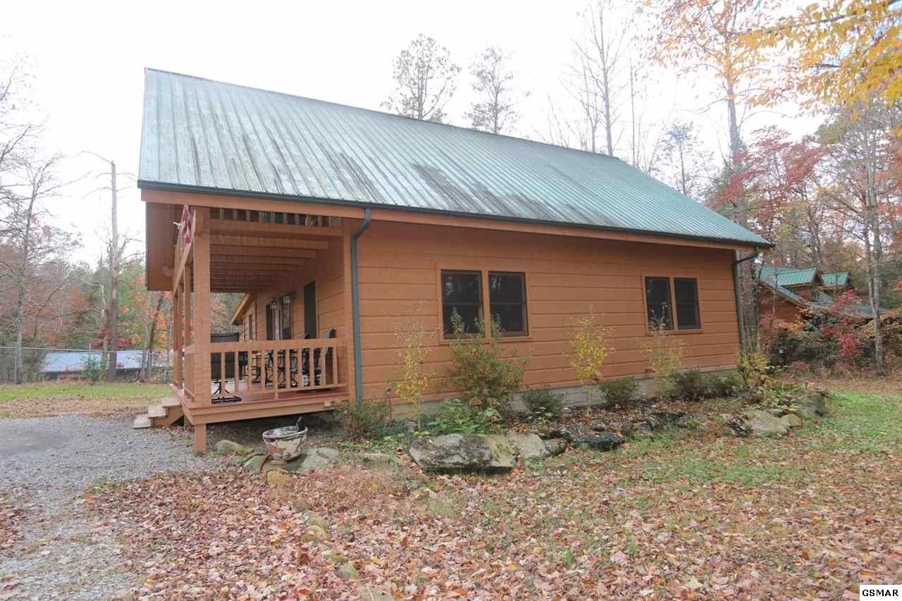 352 Warrior Ridge Way Cosby, TN 37722 - Photo 19 of 23 a front view of a house with garden