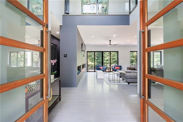 a view of an entryway with wooden floor and windows