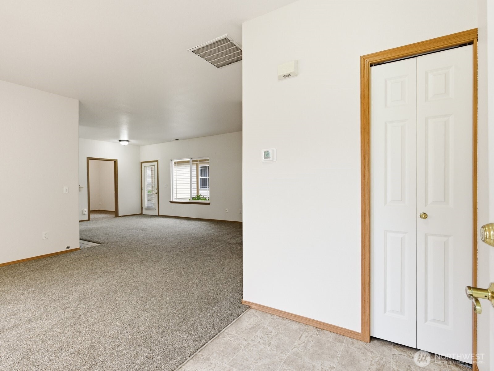 323 North Laventure Road, Unit C Mount Vernon, WA 98273 - Photo 4 of 24 a view of a big room with closet and wooden door
