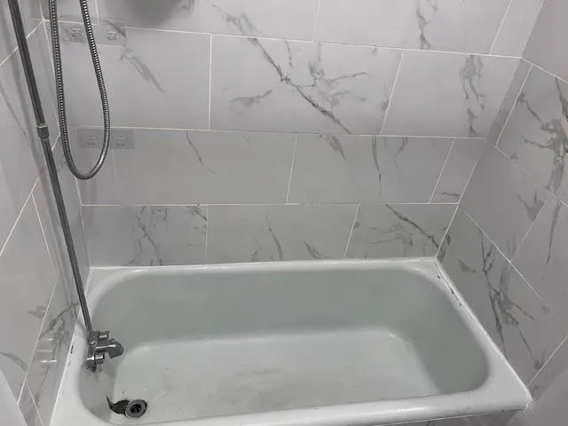 a bathroom with a bath tub