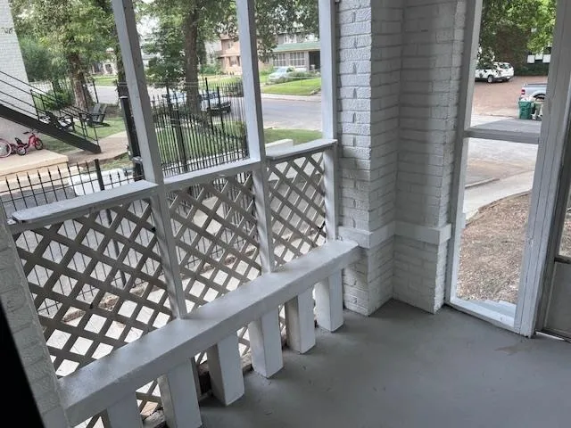 a view of balcony with wooden floor