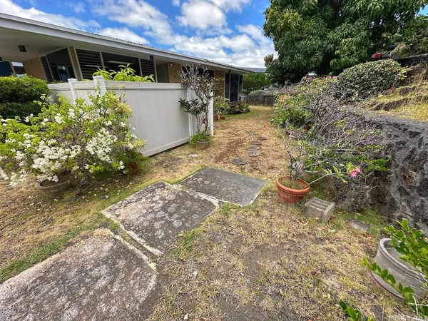 a view of a back yard of the house