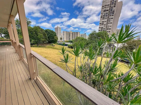 a view of balcony with wooden floor and outdoor space