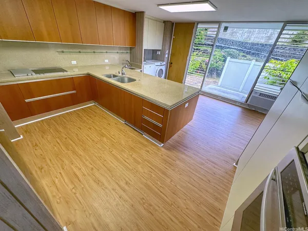 a room with wooden floors and furniture