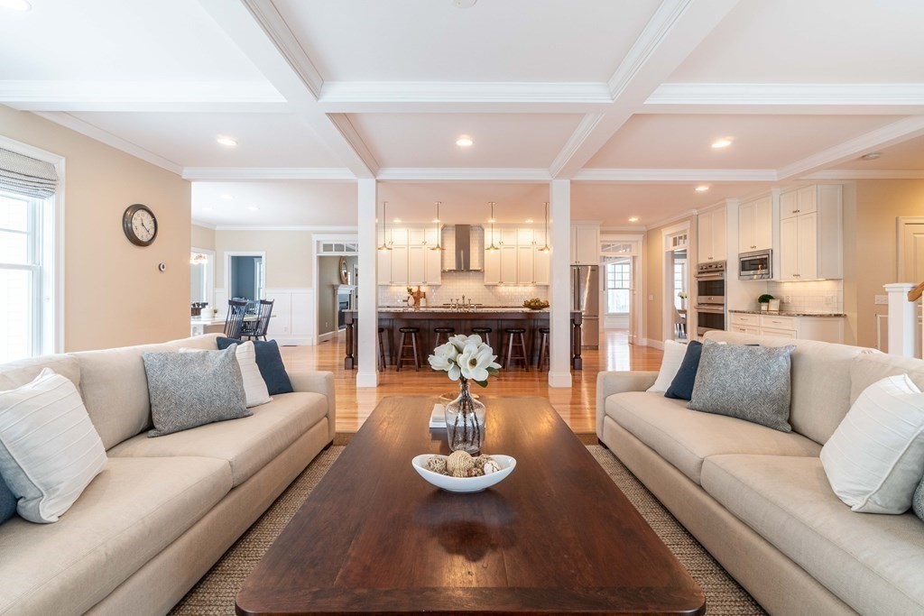 157 Walpole Street Dover, MA 02030 - Photo 17 of 38 a living room with furniture and a dining table with kitchen view