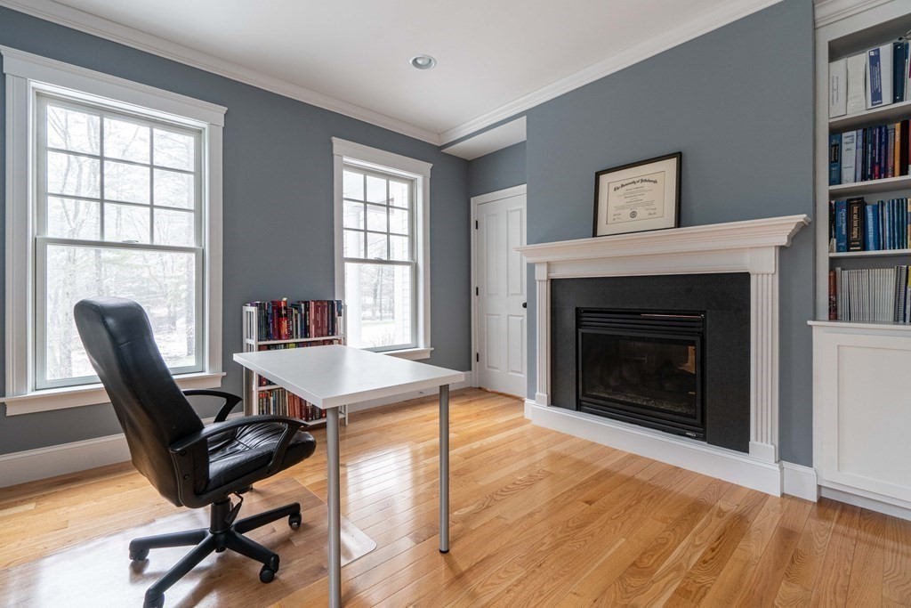 157 Walpole Street Dover, MA 02030 - Photo 18 of 38 a workspace with furniture and a fireplace