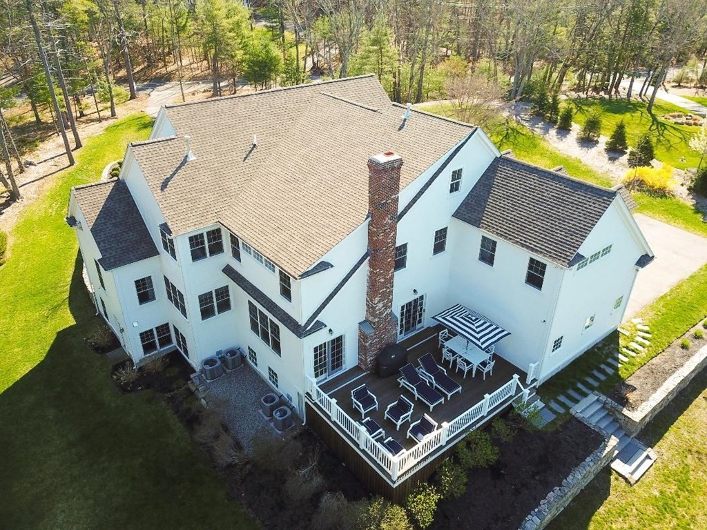 157 Walpole Street Dover, MA 02030 - Photo 2 of 38 an aerial view of a house with a swimming pool