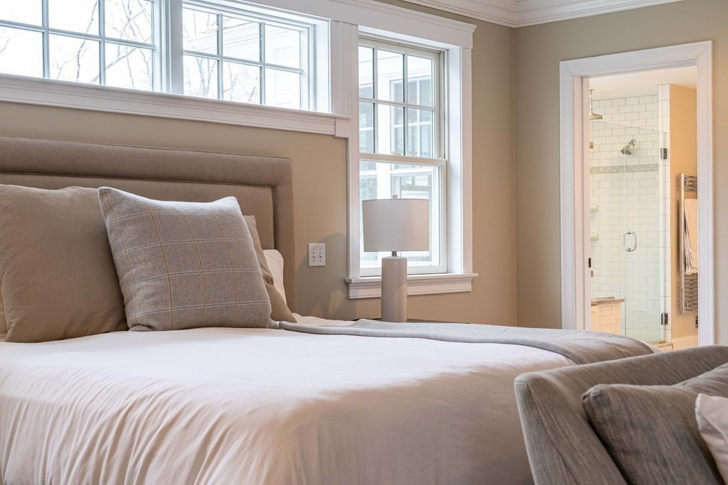 157 Walpole Street Dover, MA 02030 - Photo 22 of 38 a bedroom with a bed and a large window