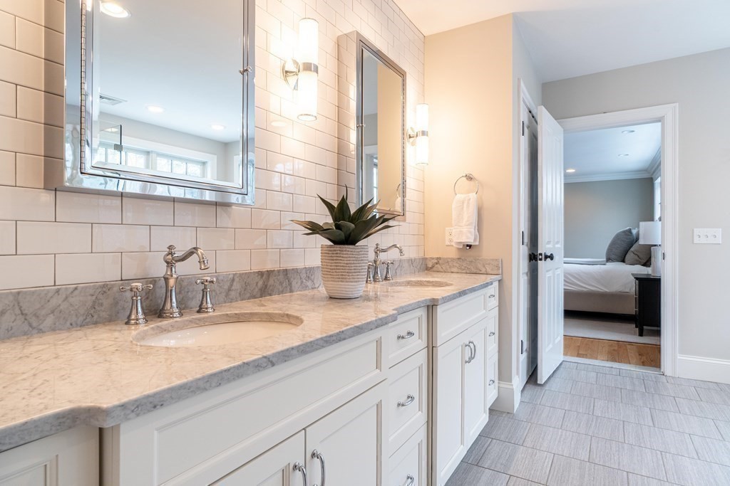 157 Walpole Street Dover, MA 02030 - Photo 25 of 38 a en suite bathroom with a double sink and a mirror