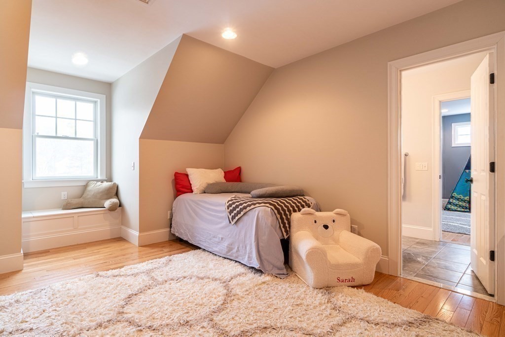 157 Walpole Street Dover, MA 02030 - Photo 27 of 38 a bedroom with a bed and wooden floor