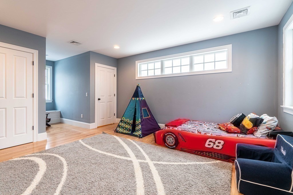 157 Walpole Street Dover, MA 02030 - Photo 28 of 38 a bedroom with a bed and a window