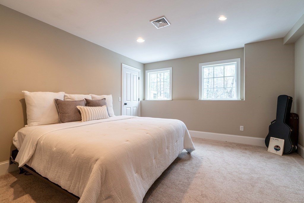 157 Walpole Street Dover, MA 02030 - Photo 29 of 38 a spacious bedroom with a bed and window