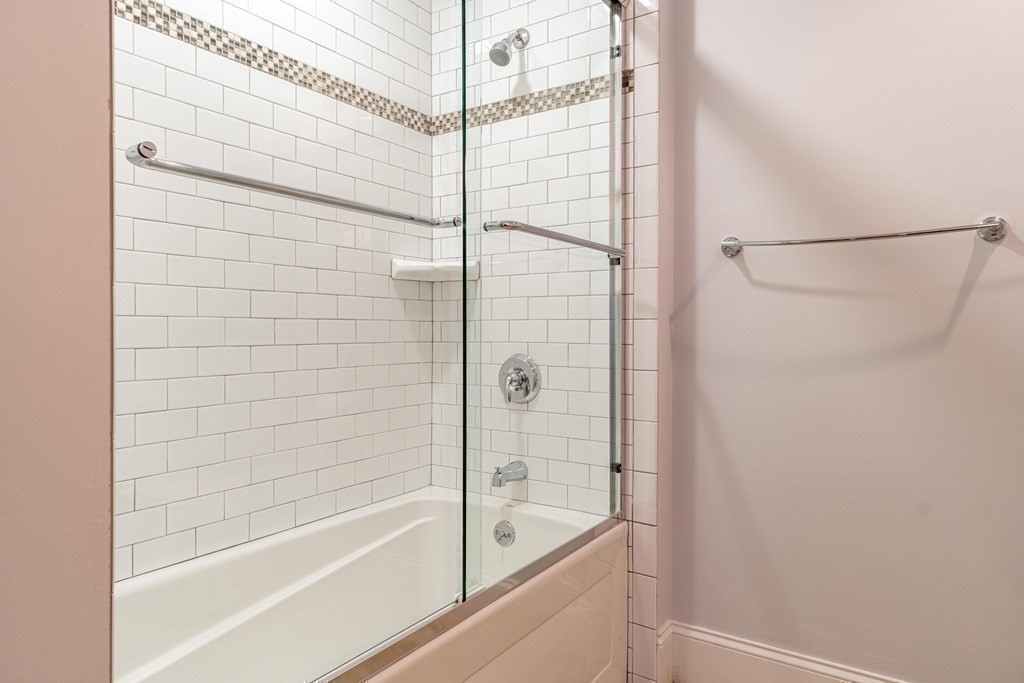 157 Walpole Street Dover, MA 02030 - Photo 32 of 38 a bathroom with a bathtub and a shower