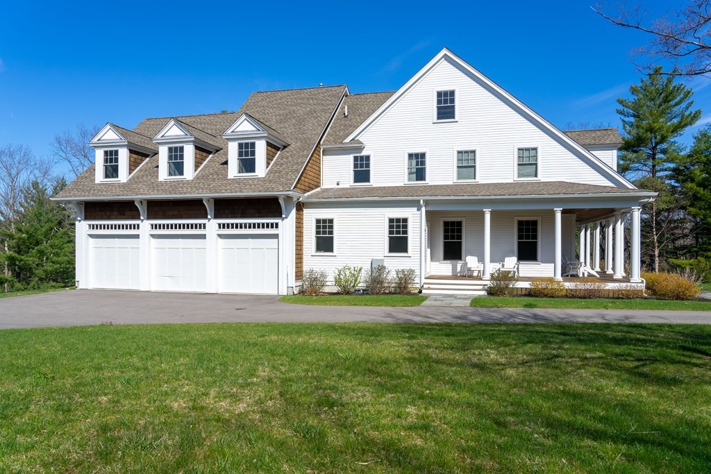 157 Walpole Street Dover, MA 02030 - Photo 38 of 38 a front view of a house with a yard and porch