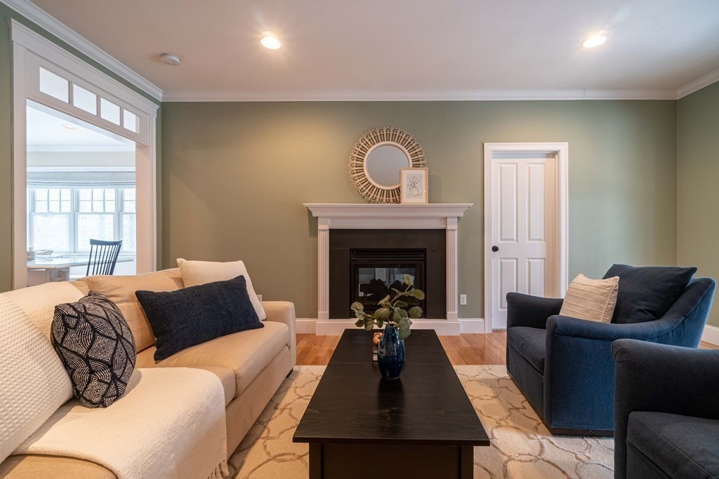 157 Walpole Street Dover, MA 02030 - Photo 4 of 38 a living room with furniture and a fireplace