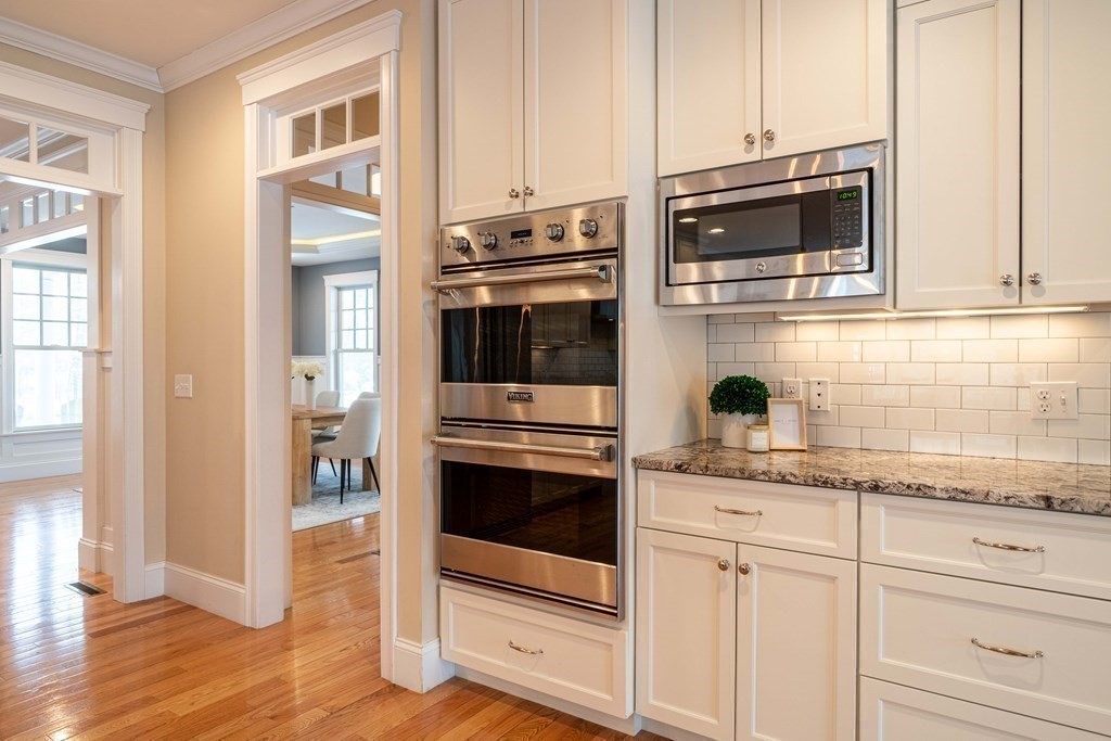 157 Walpole Street Dover, MA 02030 - Photo 10 of 38 a kitchen with stainless steel appliances granite countertop a stove and a microwave