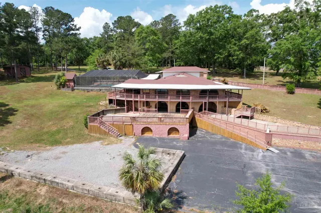 an outdoor space with furniture and garden